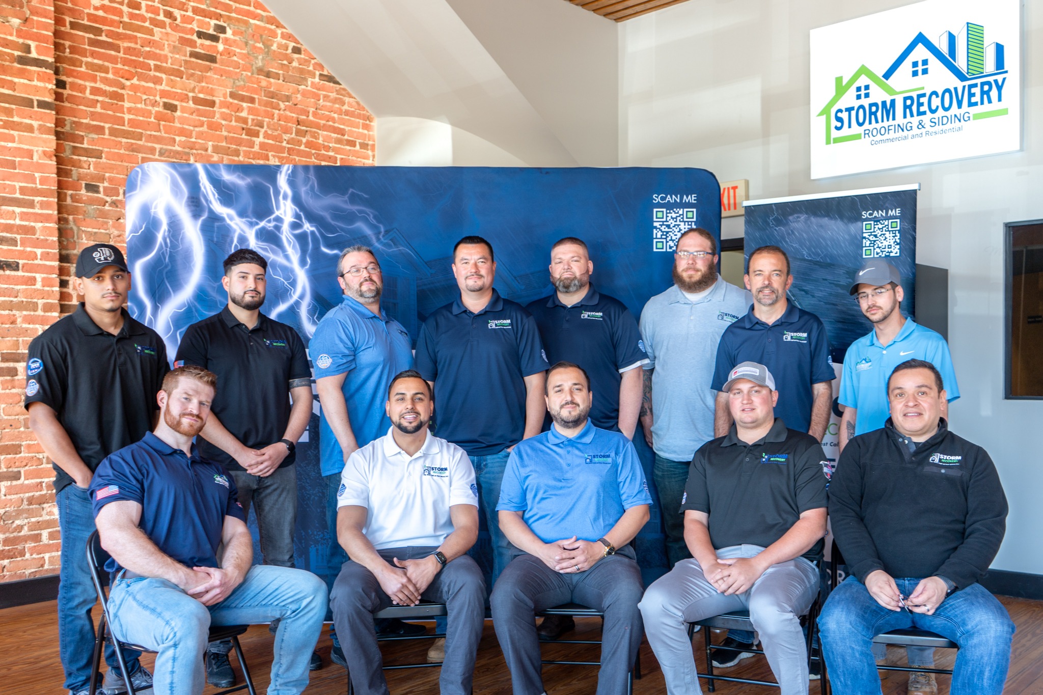 The team behind Storm Recovery Roofing & Siding poses together for a photo.