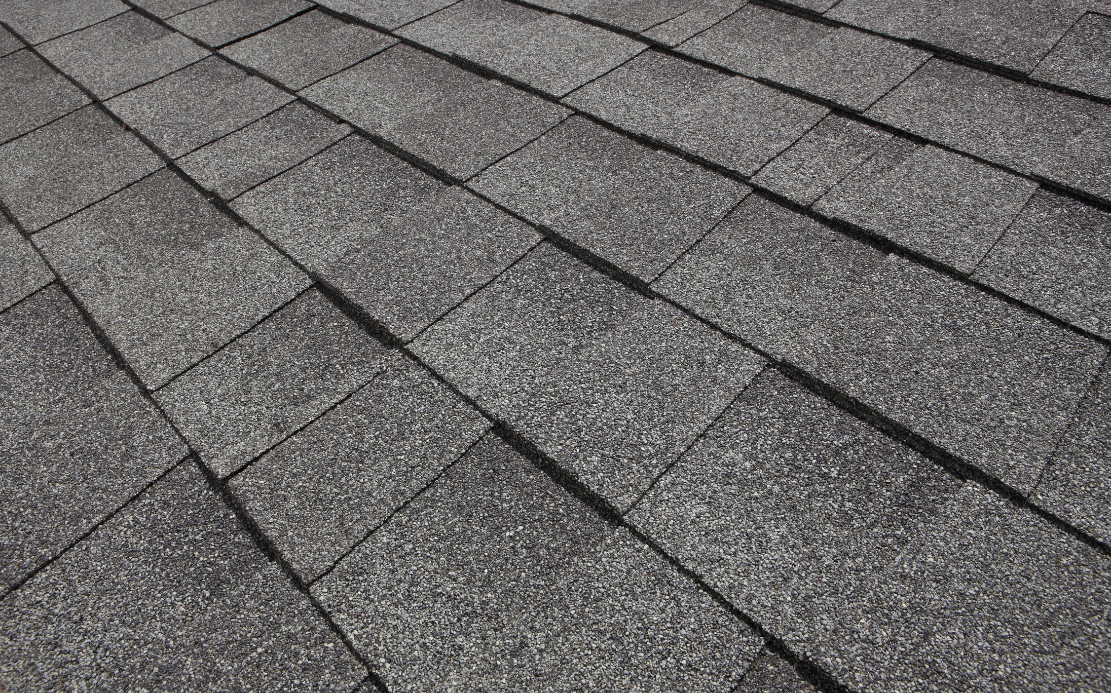 A patch of shingles on a tile roof.